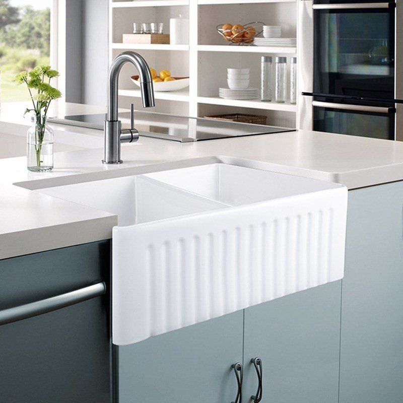 This Ceramic farmhouse sink from Bathroom sales direct sits proud out from the cabinets