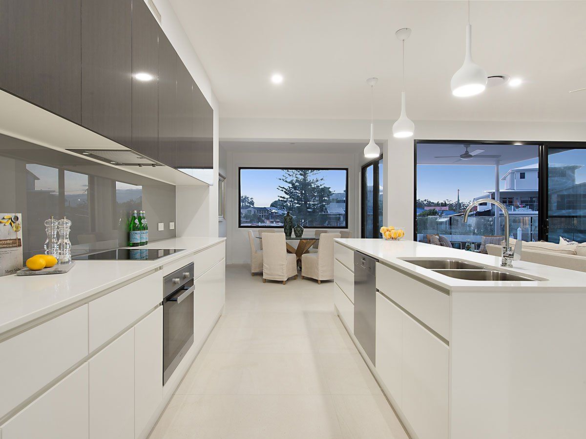 Sleek and modern  galley style kitchen.