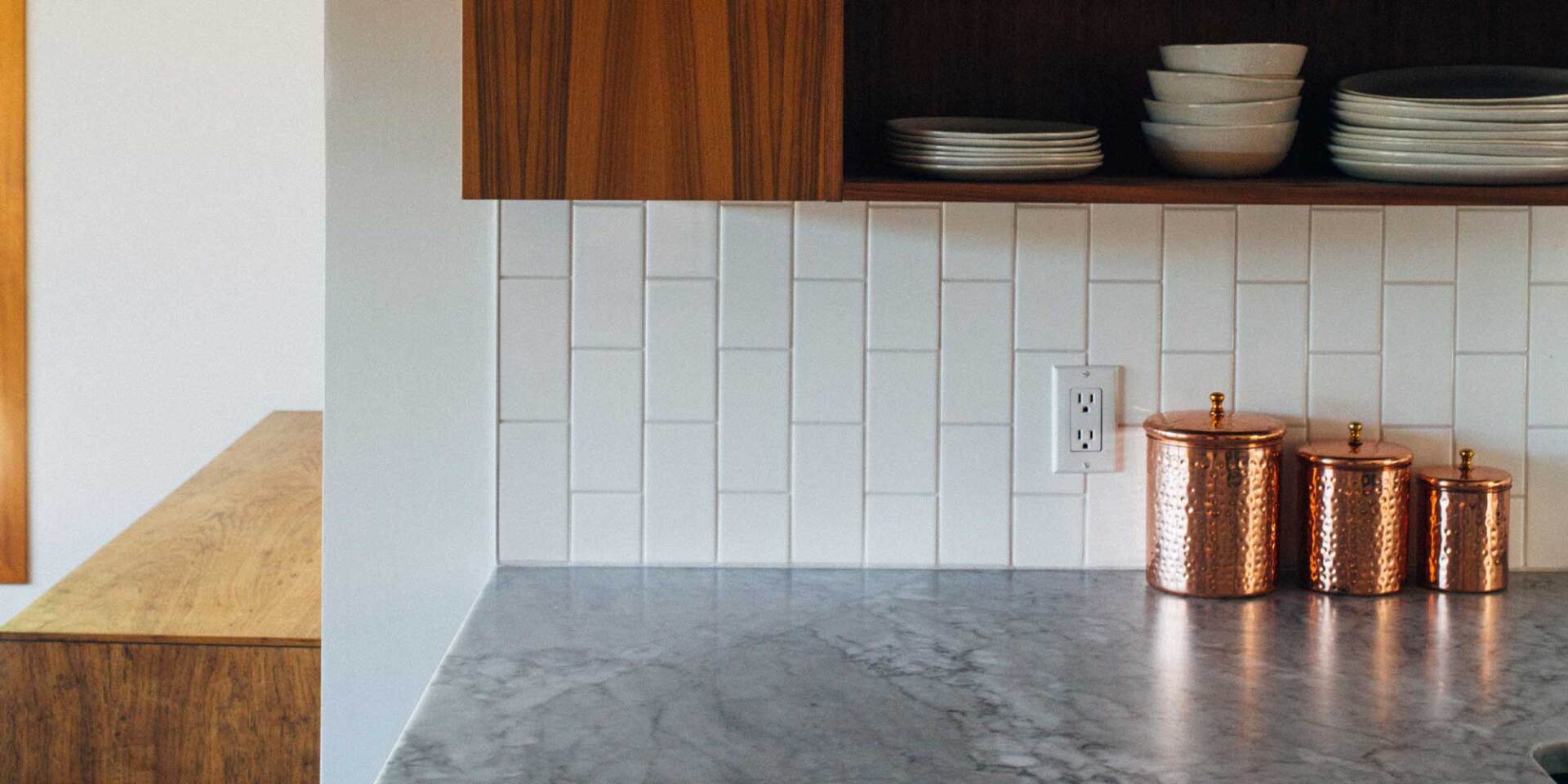 Laying traditional subway tile in a vertical aspect creates a more alternative look.