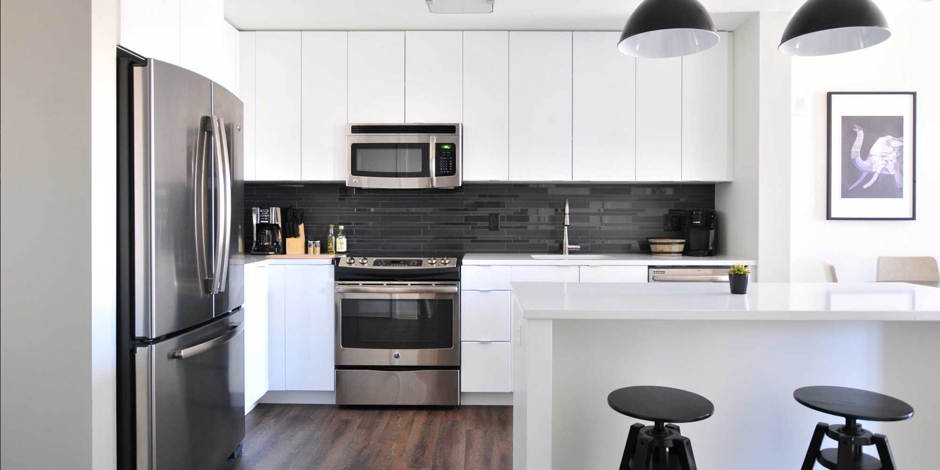 White kitchen with dark gray tile backsplash