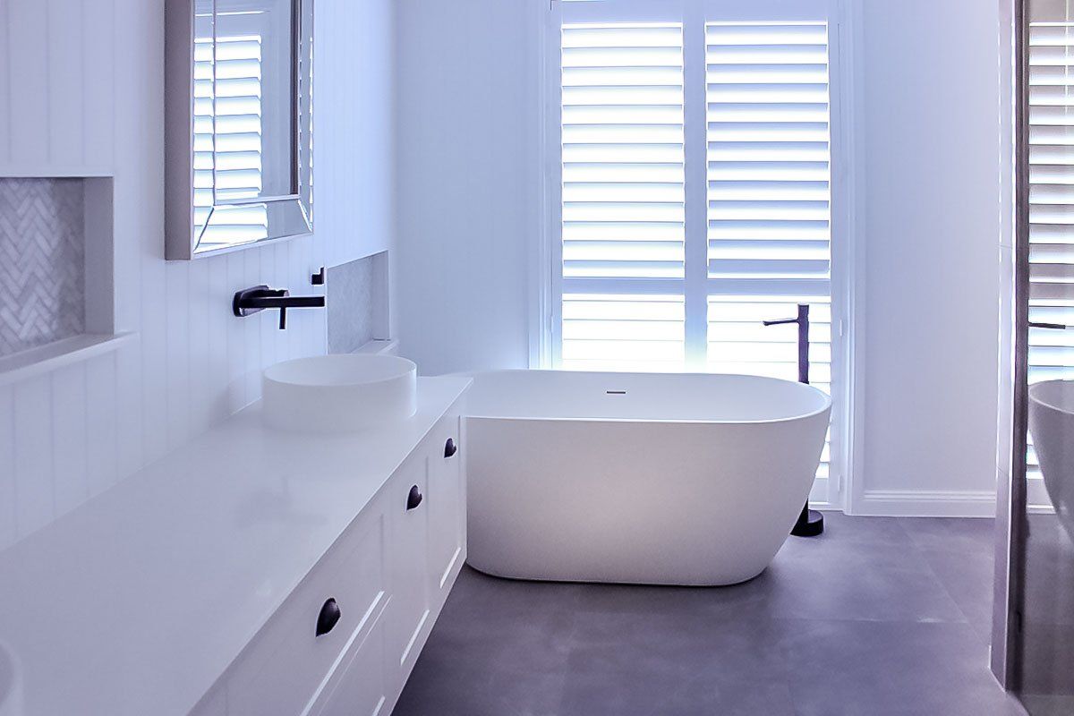 Create a timeless bathroom with all white and black fixings.