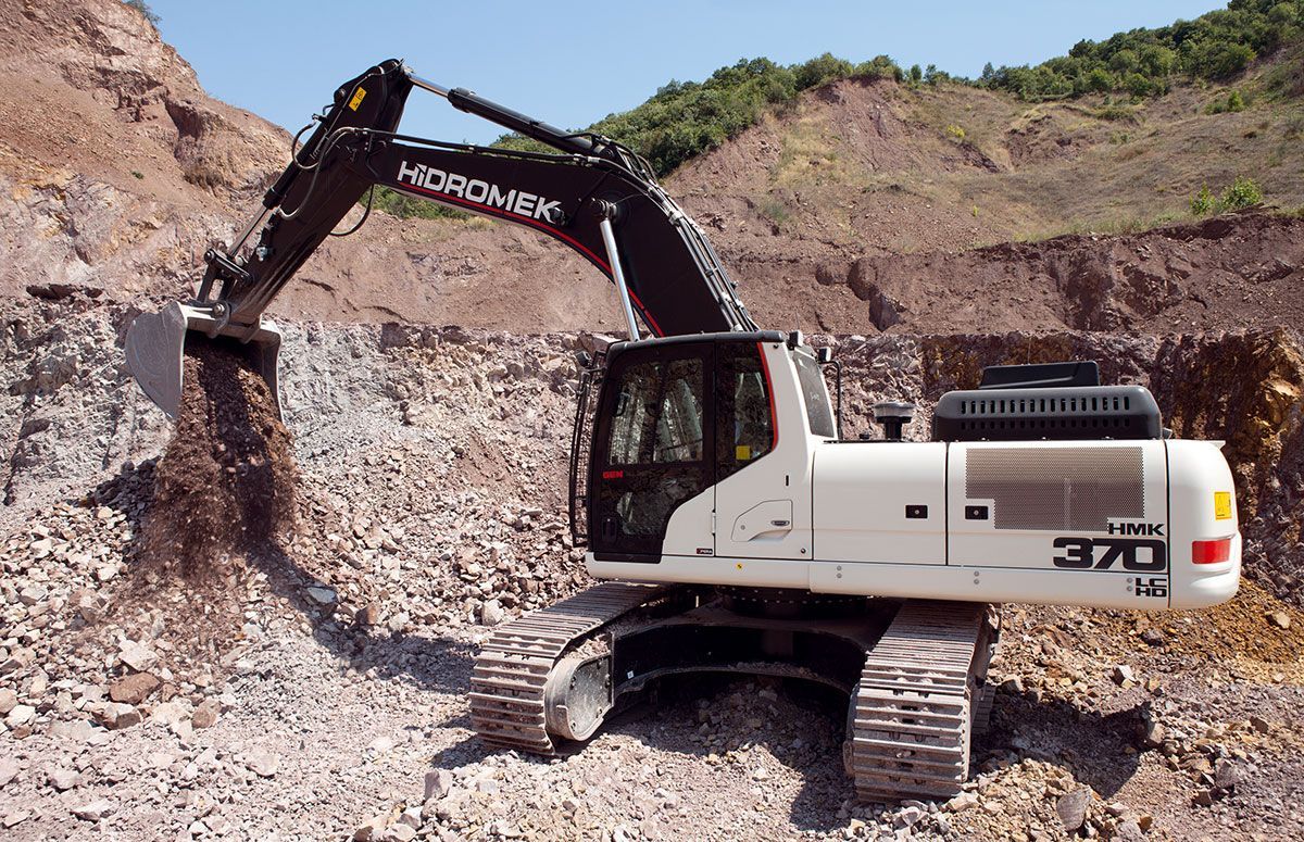 A white excavator with the number 370 on it