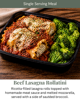 Beef Lasagna Rollatini meal in a black container, featuring pasta rolls with meat sauce, cheese, and sautéed broccoli.