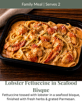 A container of Lobster Fettuccine in seafood bisque with herbs and parmesan, labeled as a family meal for two.