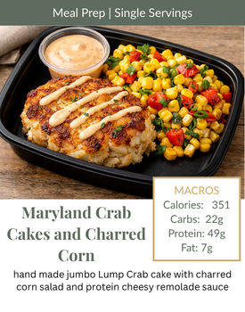 A meal prep container with a crab cake drizzled in sauce, a side of charred corn salad, and a cup of remoulade.