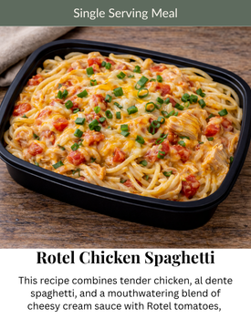 A black container holds creamy Rotel chicken spaghetti topped with melted cheese and green onions on a wooden table.