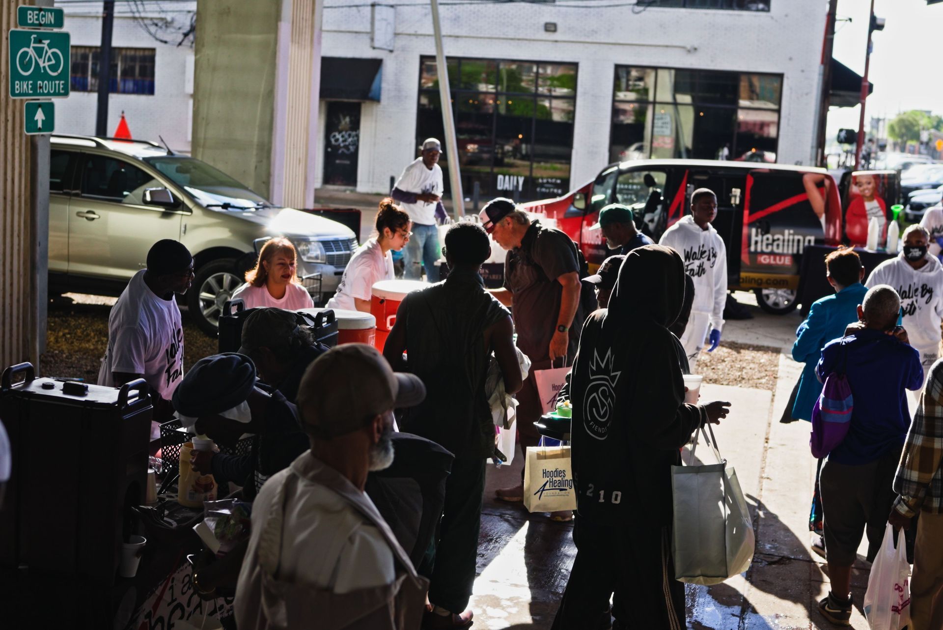 A group of people are standing in front of a building.