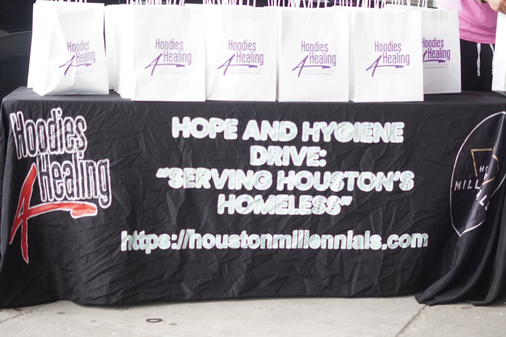 A table with a sign that says hope and hygiene drive