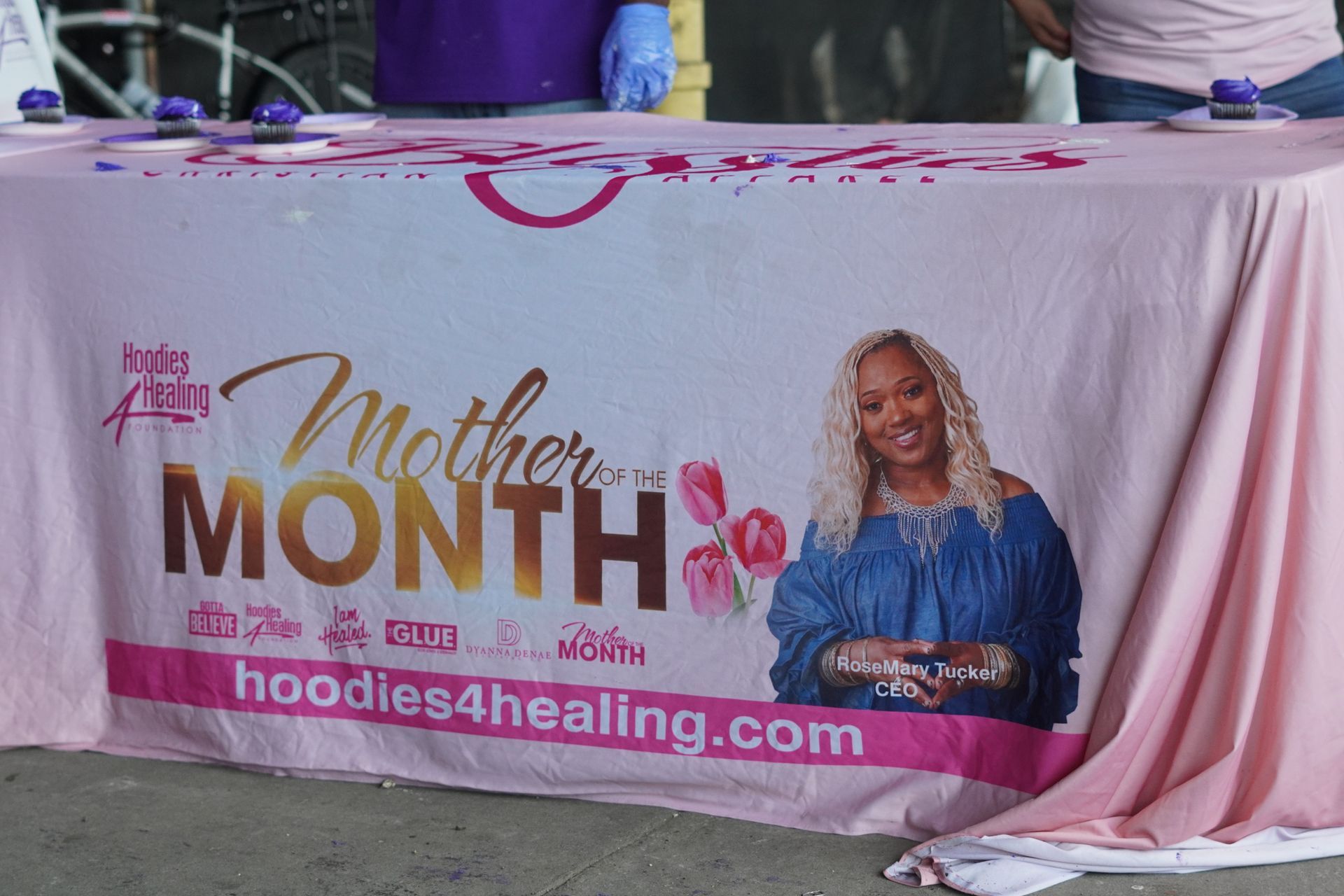A pink table cloth with a picture of a woman on it for mother 's month.
