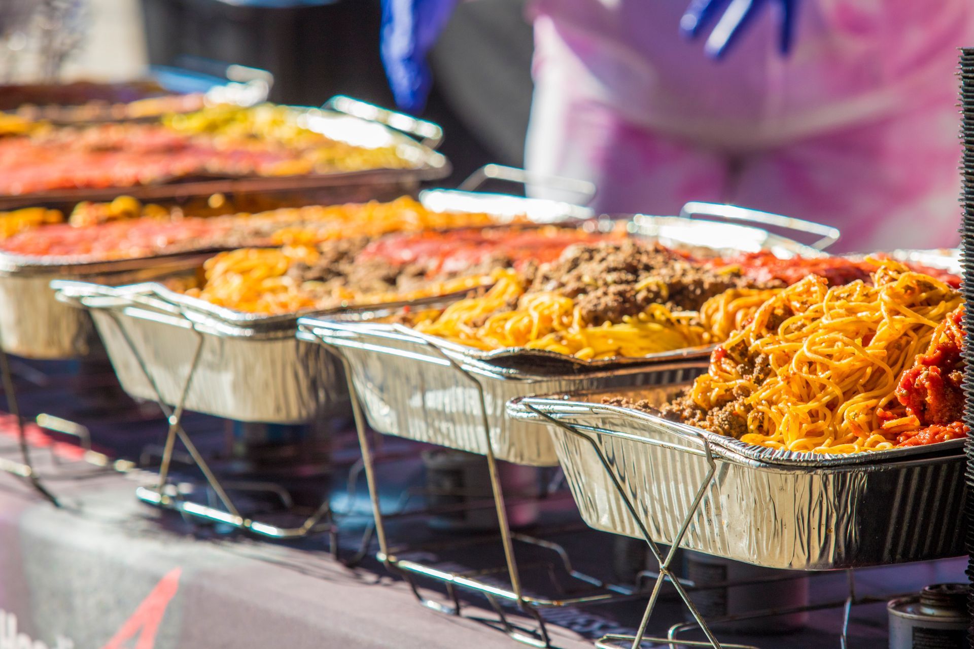 A buffet line filled with lots of different types of food.