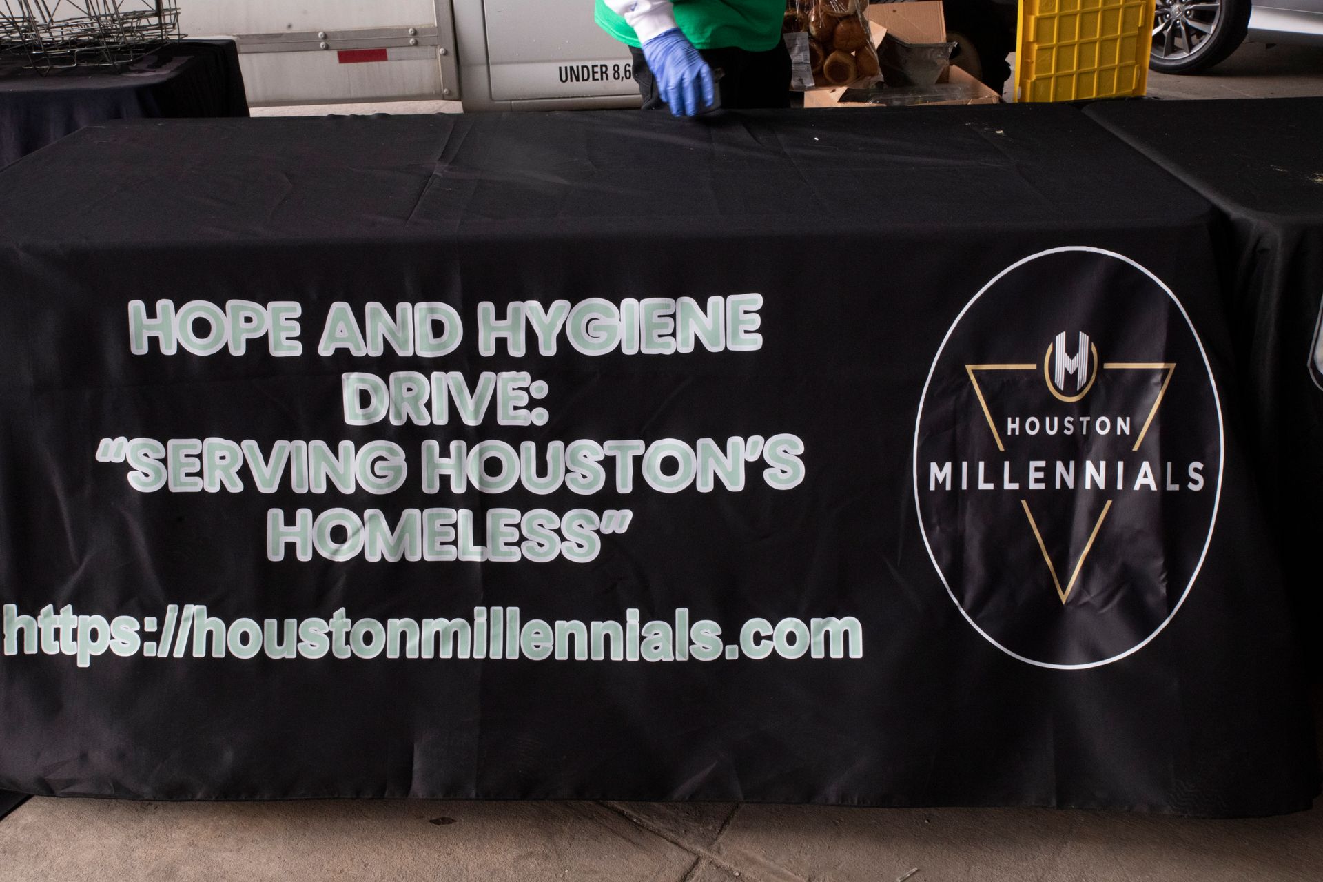 A black table cloth with hope and hygiene drive written on it