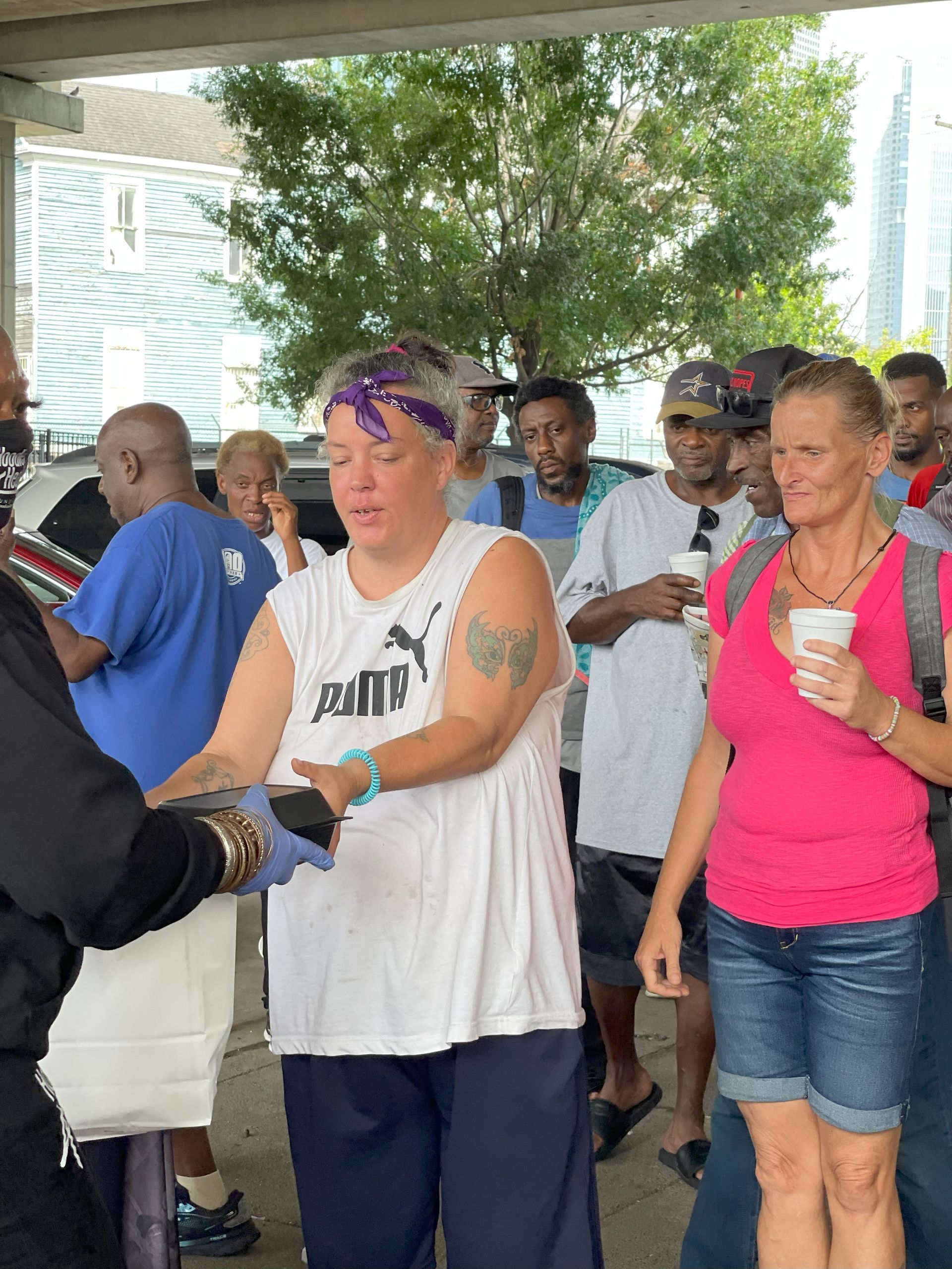 A group of people are standing in a line.