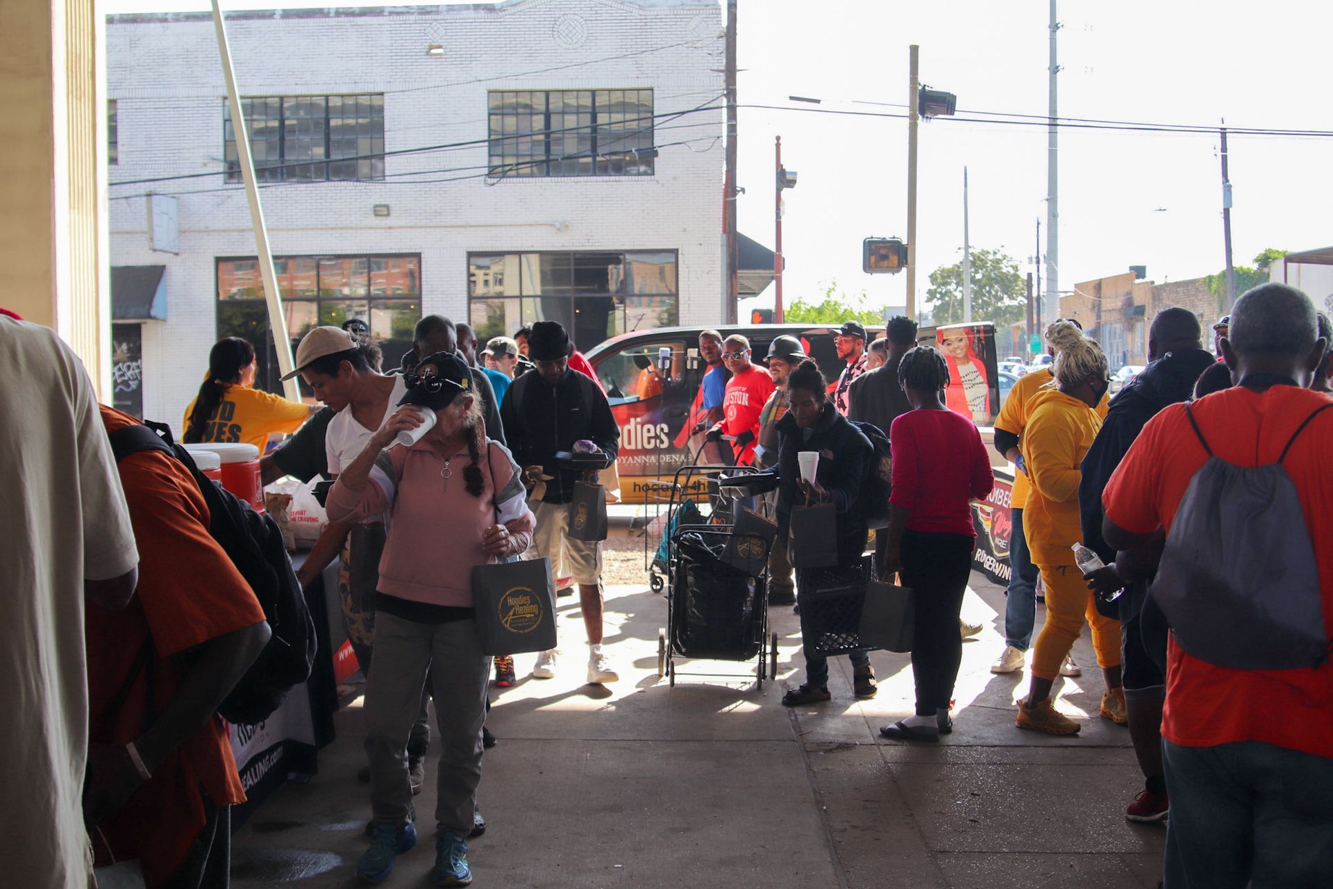 A group of people are standing in front of a building.