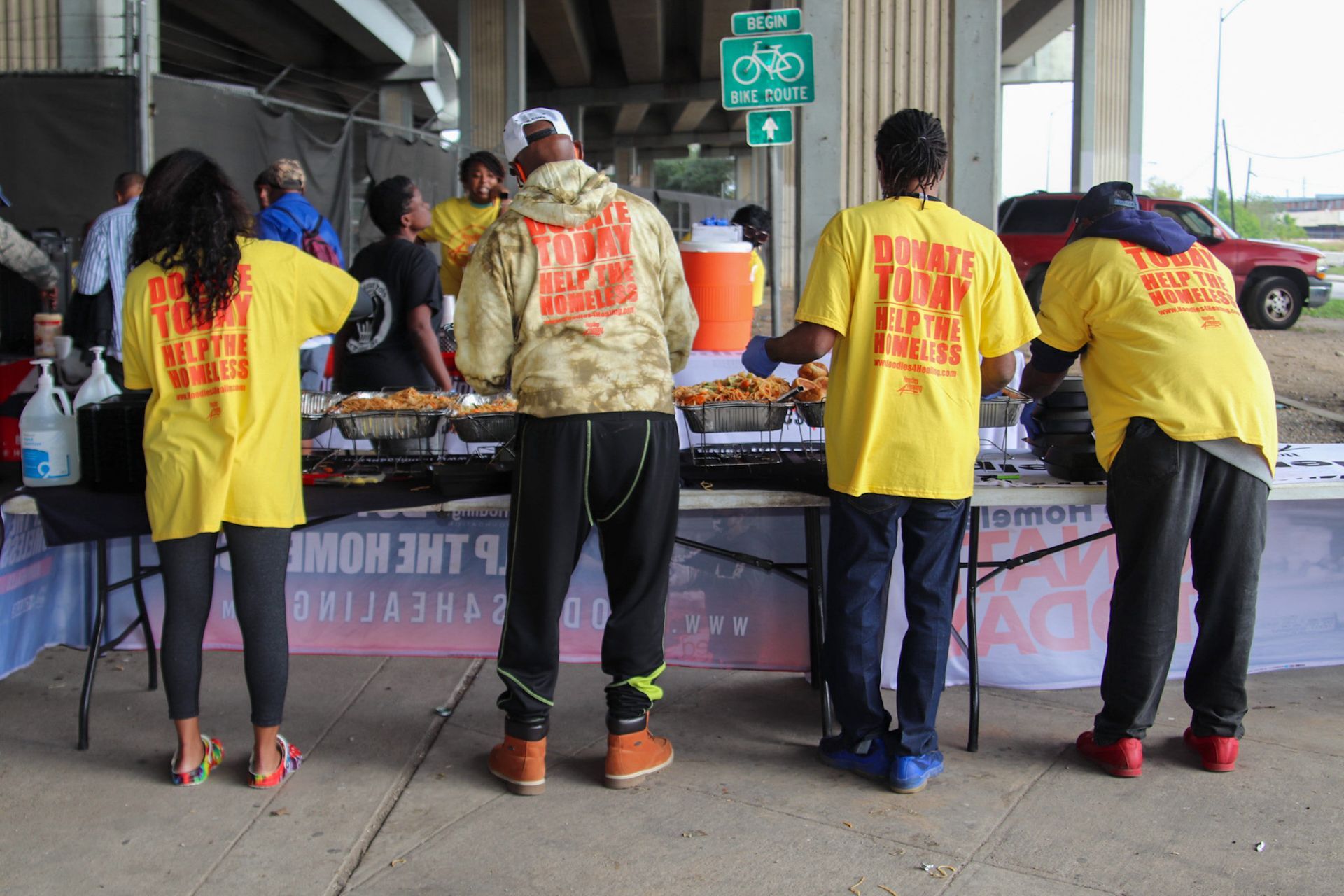 A group of people wearing yellow shirts with the word freedom on them