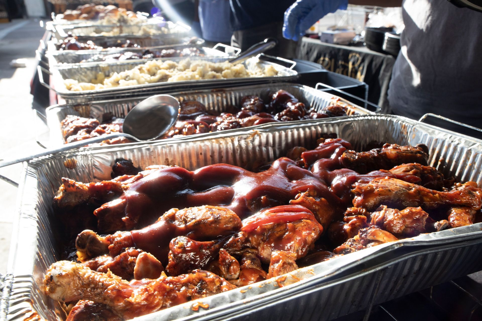 A buffet line filled with lots of food including chicken