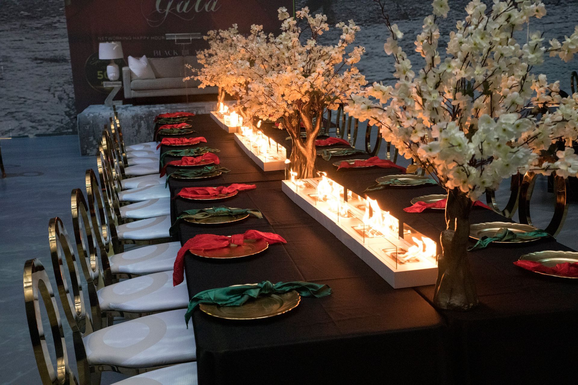 A long table with flowers and candles on it