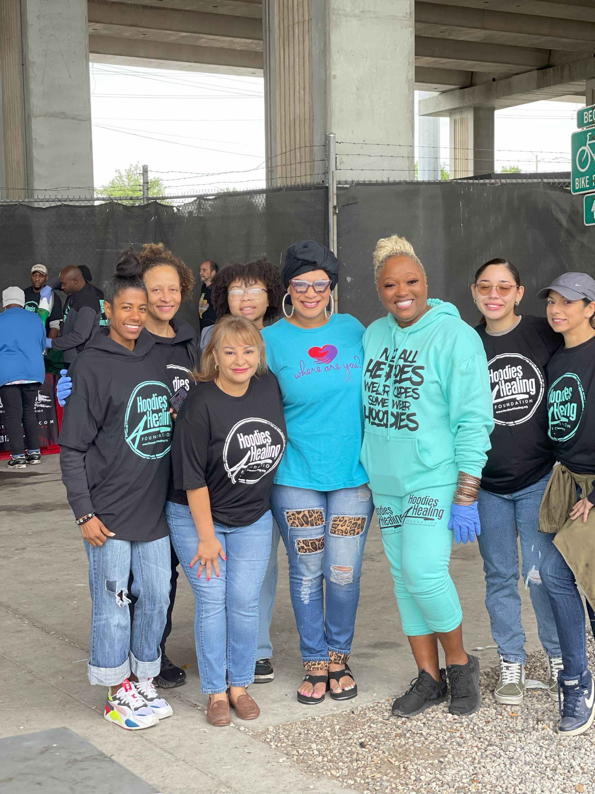 A group of women are posing for a picture together.