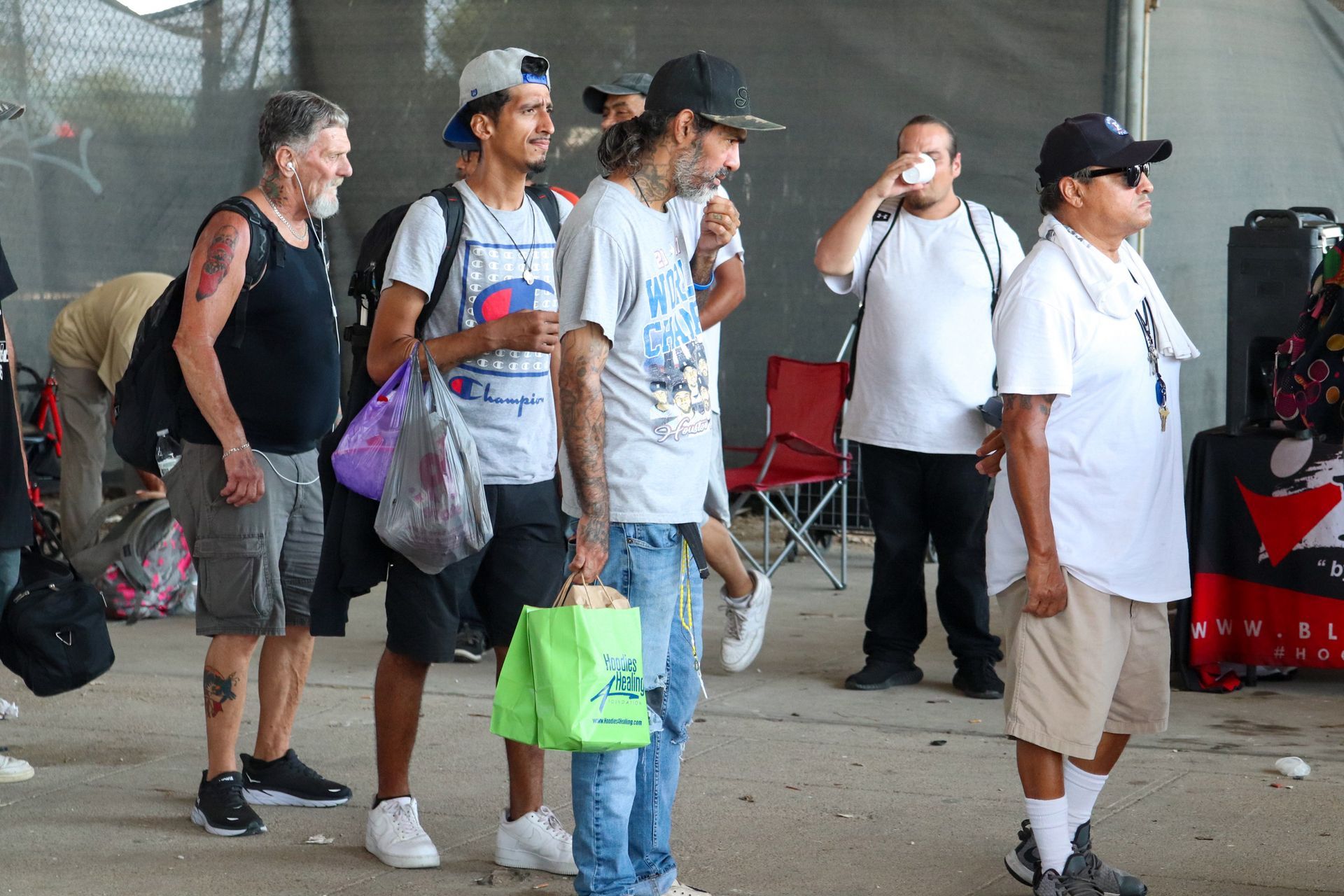 A group of people are standing in a line.