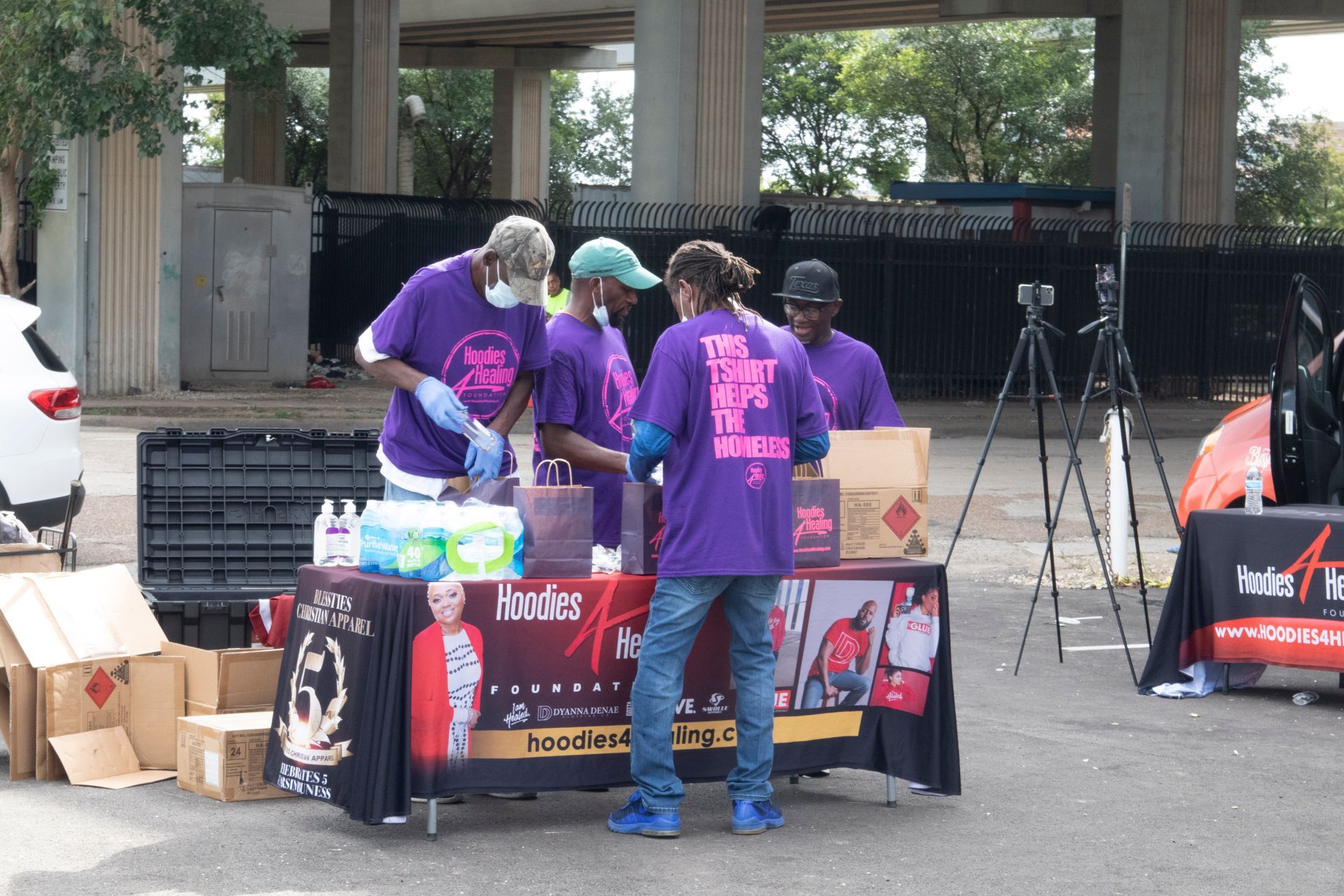 A group of people wearing purple shirts with the word smoke on them