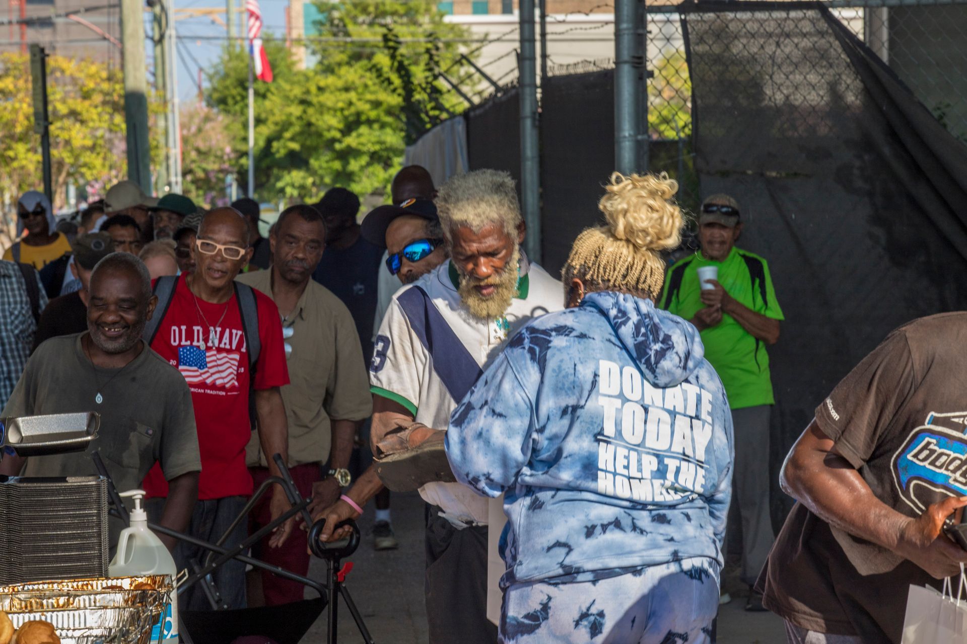 A group of people are standing in a line.