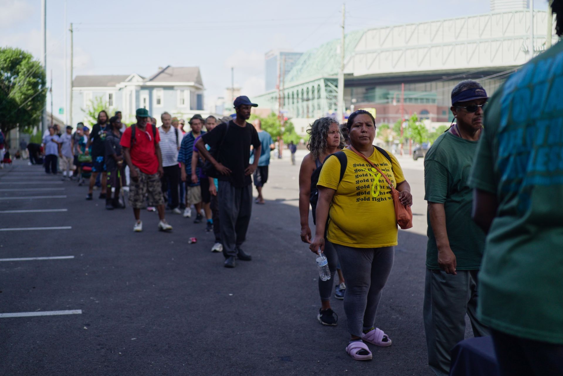 A group of people are walking down a street.