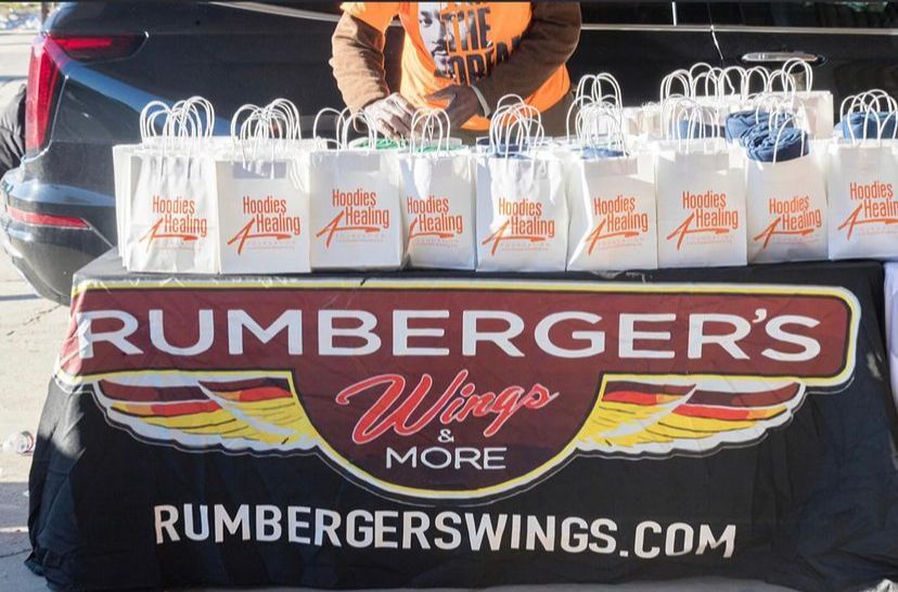 A table with rumberger 's wings and more bags on it