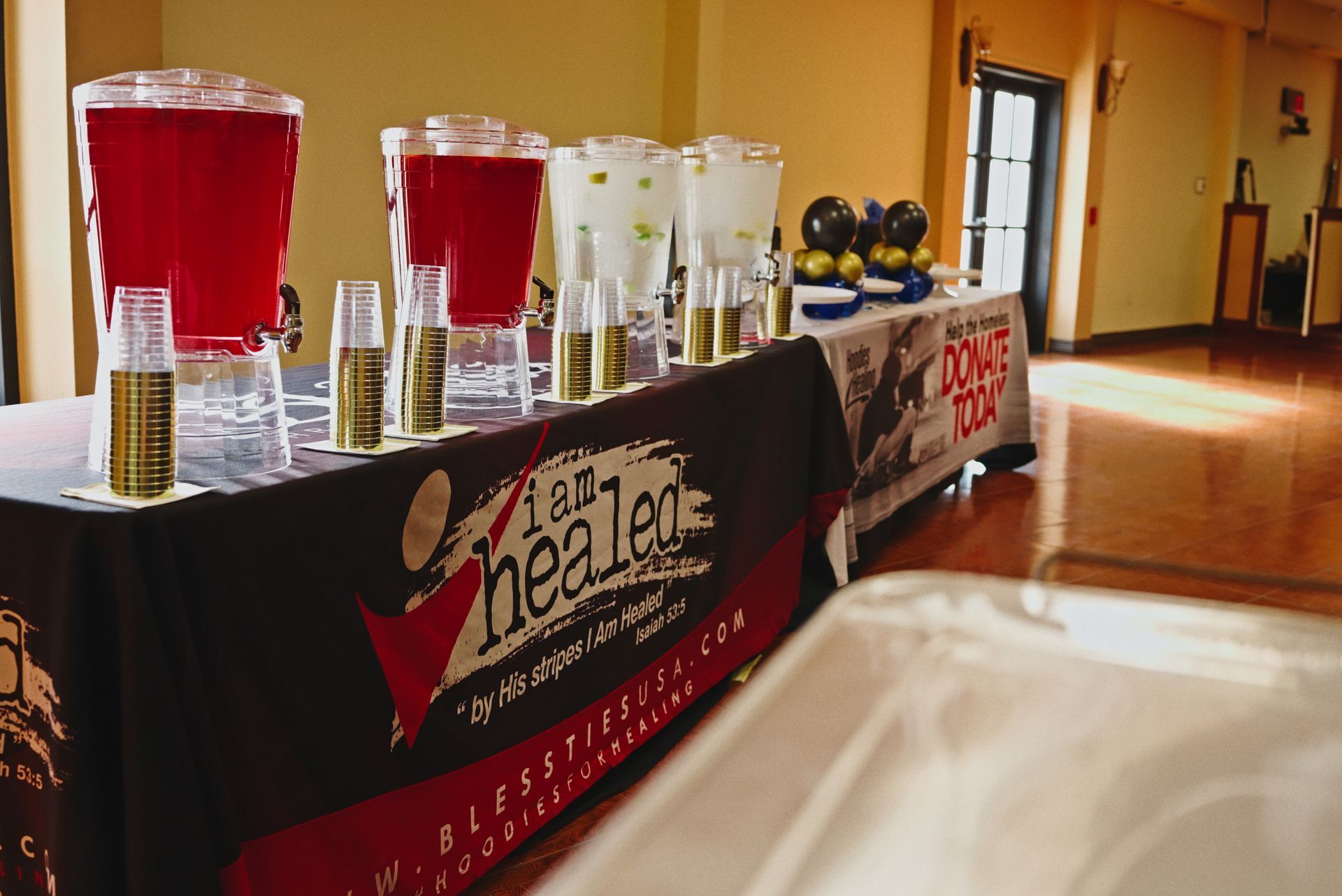 A table with a table cloth that says ' let 's healer ' on it