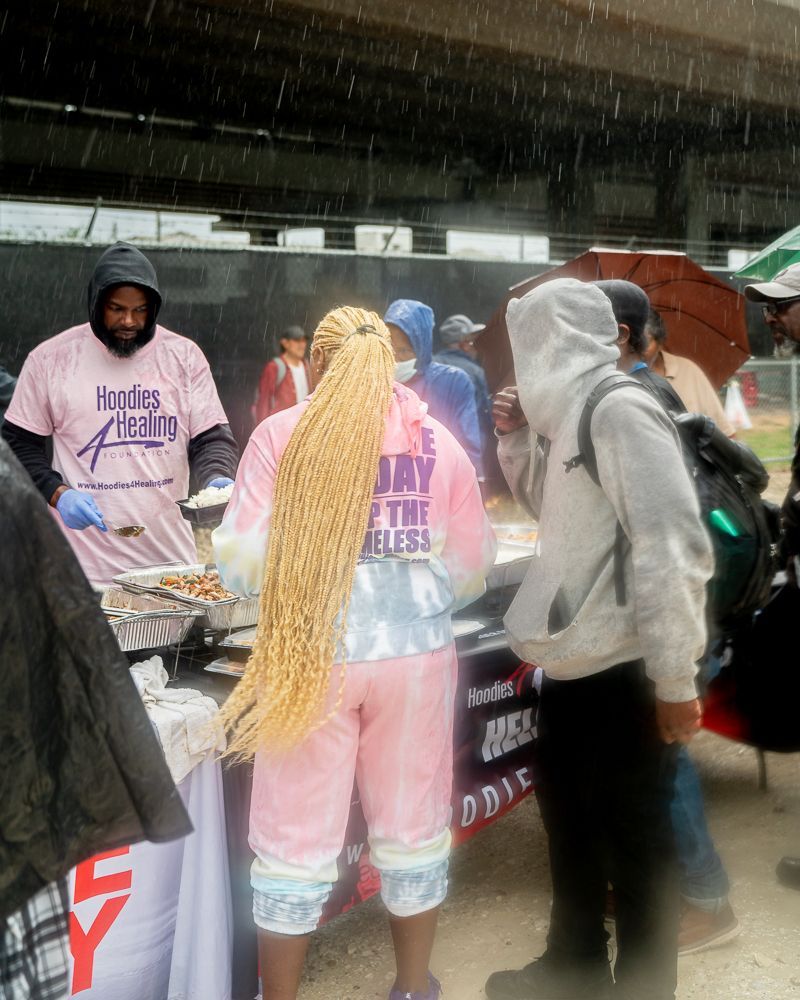 A woman in a pink shirt that says jay on it