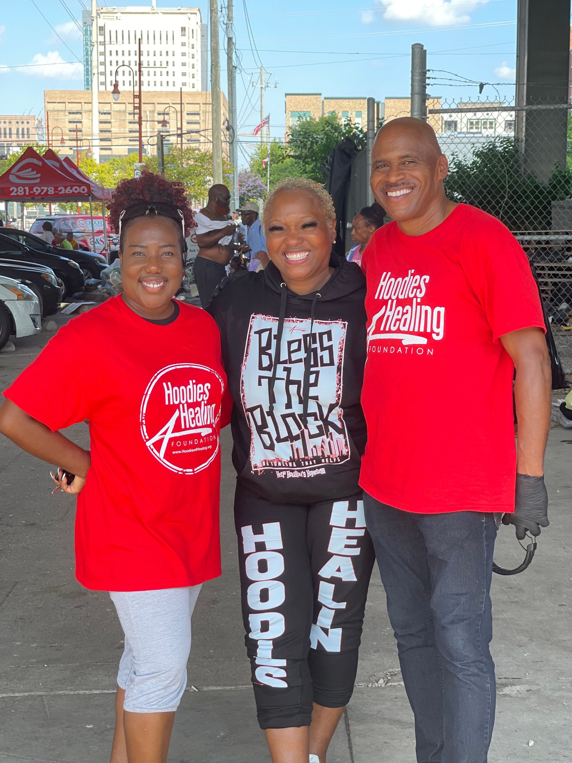 A woman wearing a hoodie that says bless the black hoodie