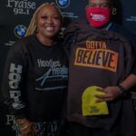 A man and a woman wearing masks are posing for a picture.