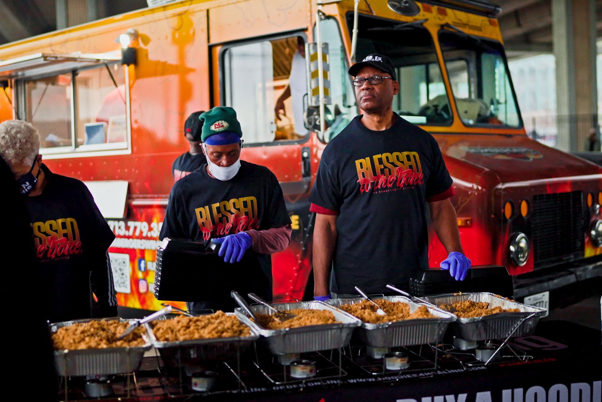 A man wearing a red shirt that says ' miami ' on it