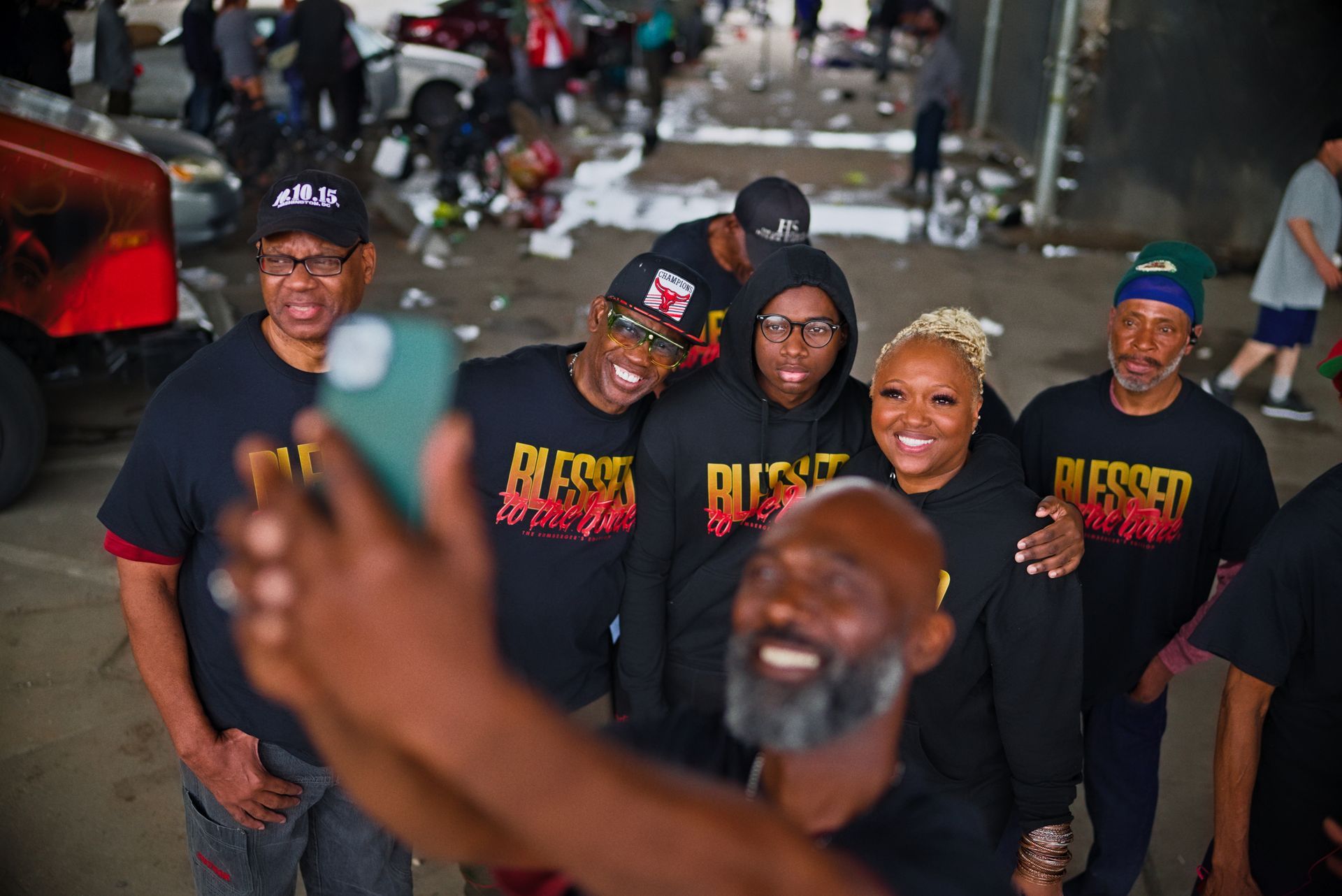 A group of people are serving food at a buffet.