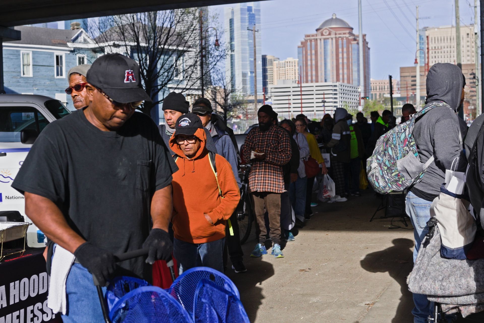A man standing in front of a sign that says 