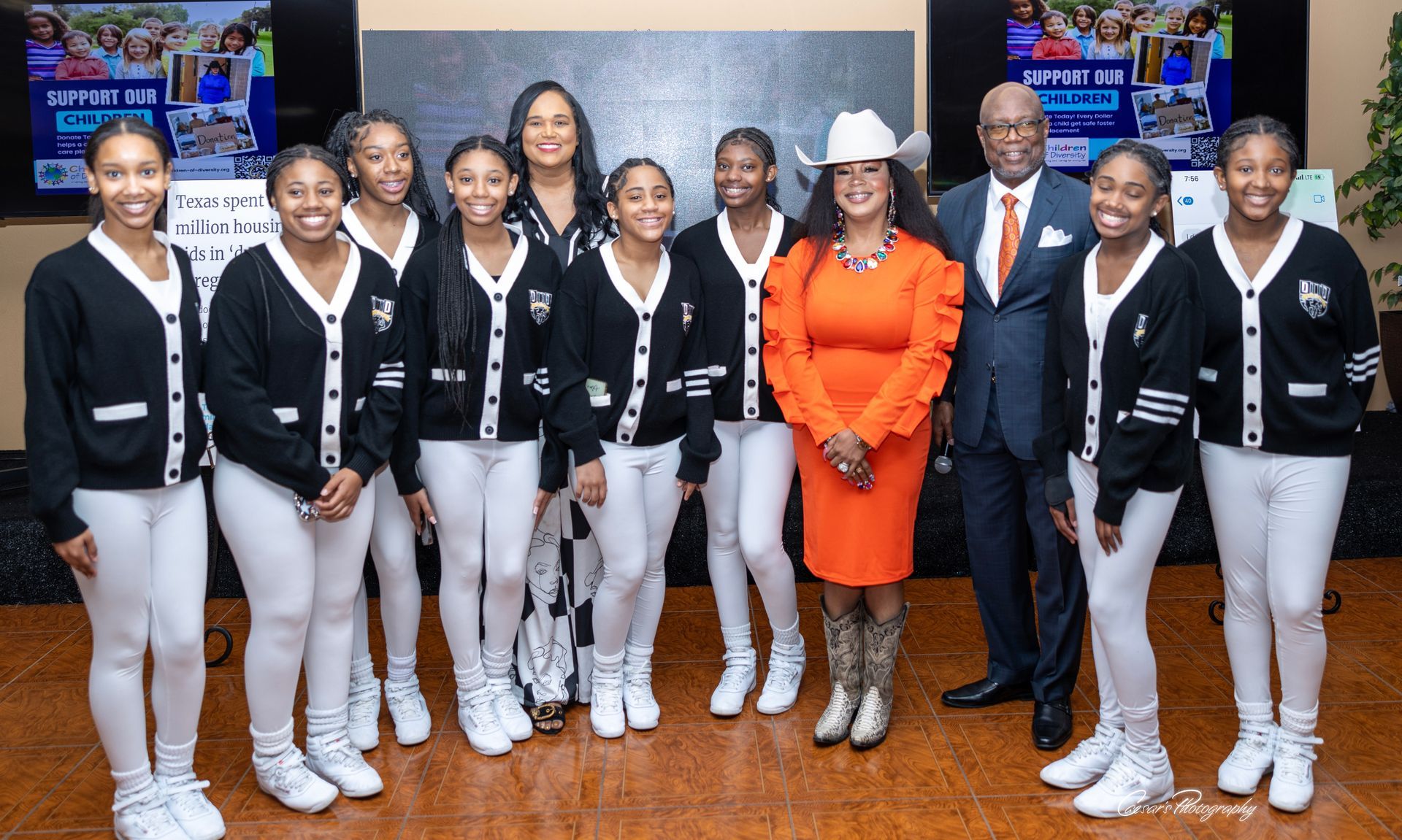 A group of people are posing for a picture together.