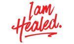 A red handwritten sign that says `` i am healed '' on a white background.