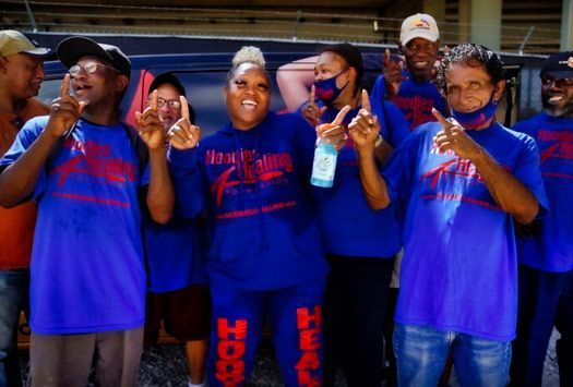 A group of people wearing blue shirts that say respect