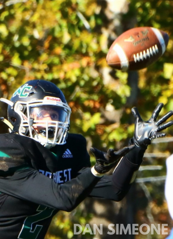 football player catching a football
