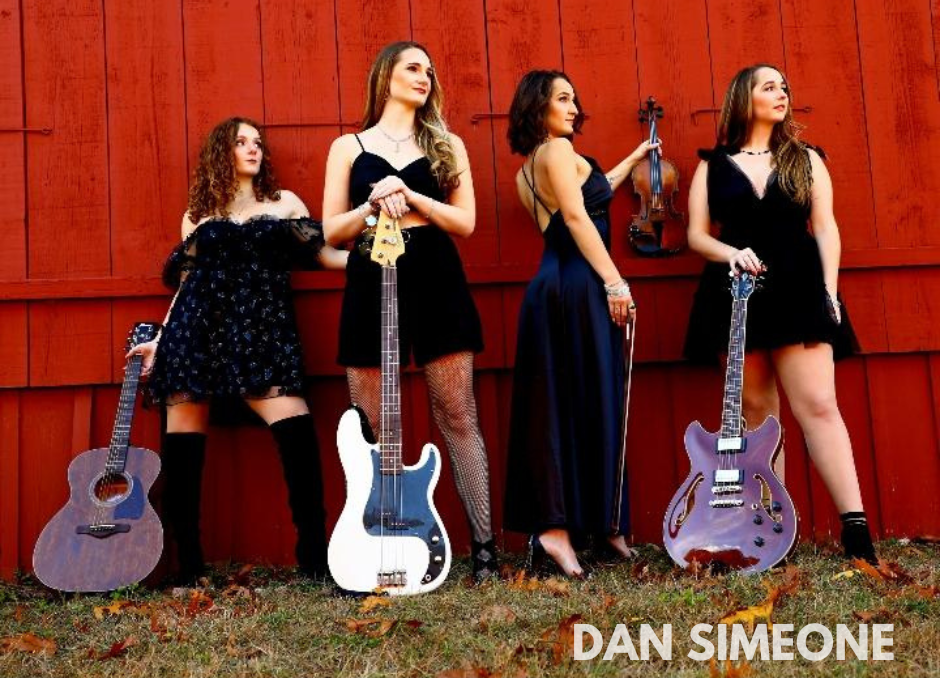 singing girl group posing with guitars