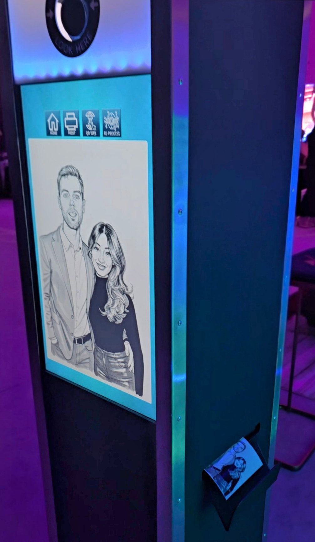 Vertical touchscreen AI photo booth displaying a black and white portrait with neon lighting around it