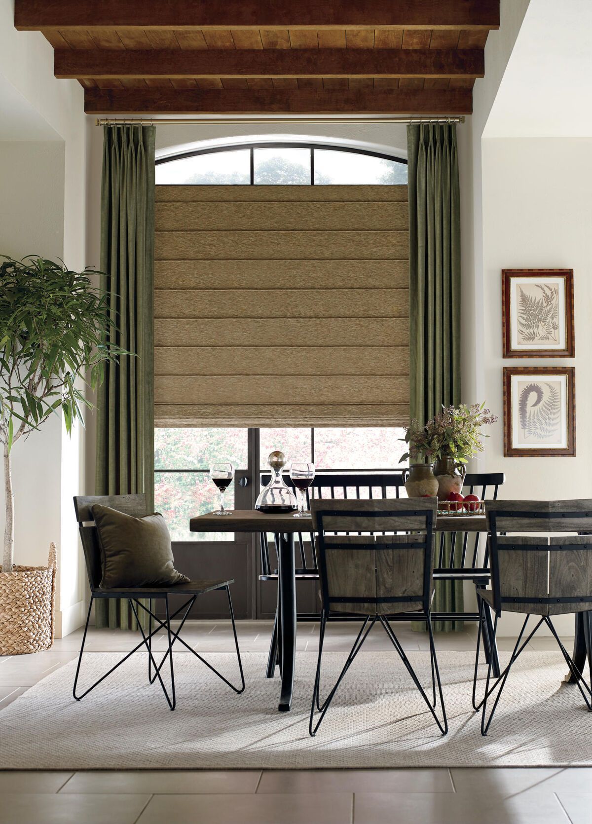 Dining room with table, chairs, window with roman shades, and green curtains.
