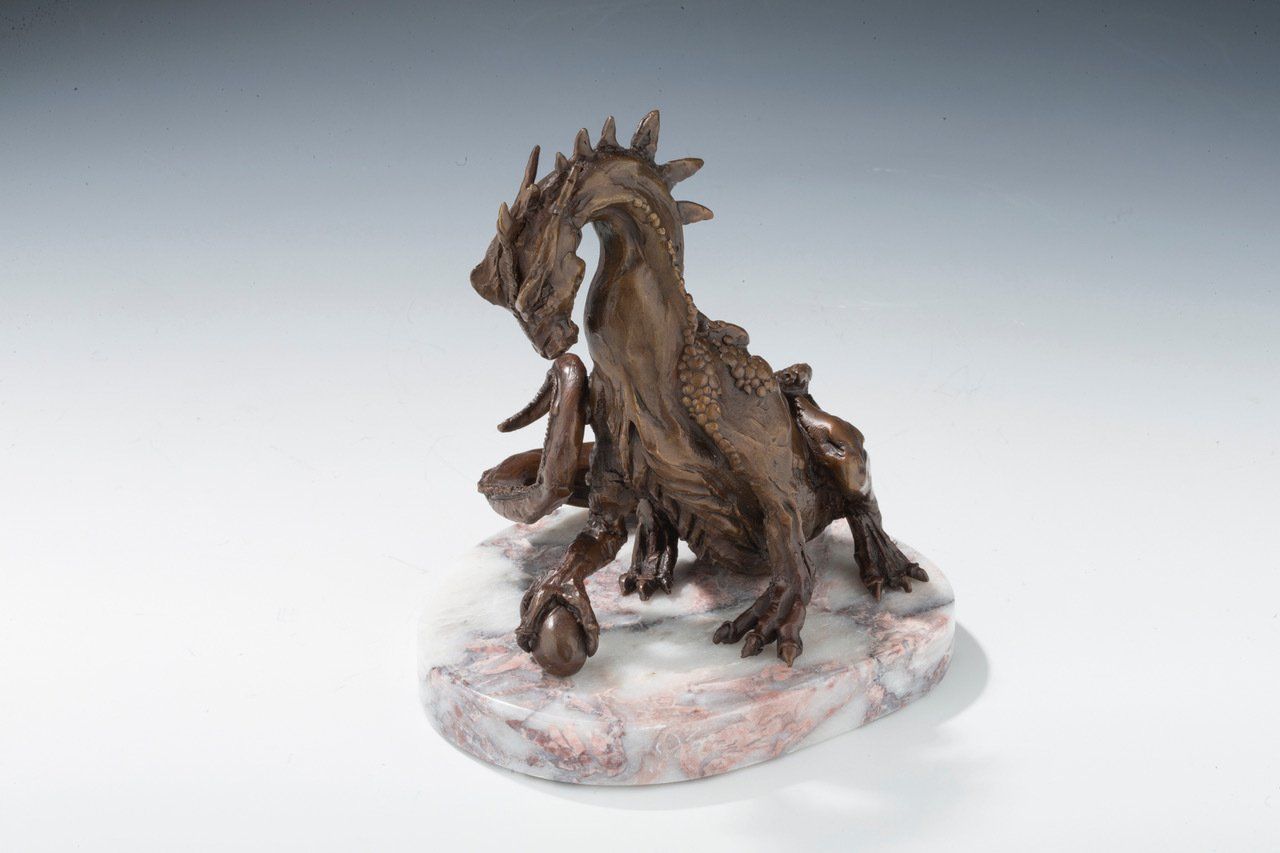 Mother Dragon with Egg sculpture in light base