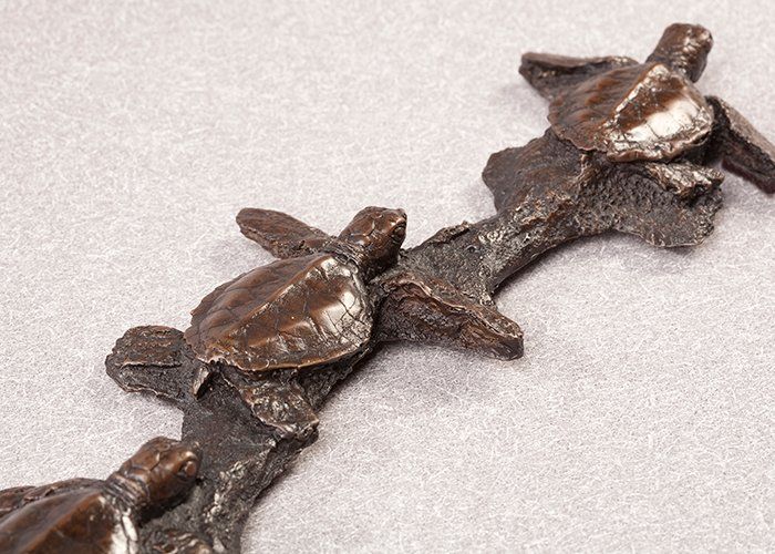green sea turtle hatchlings bronze sculpture