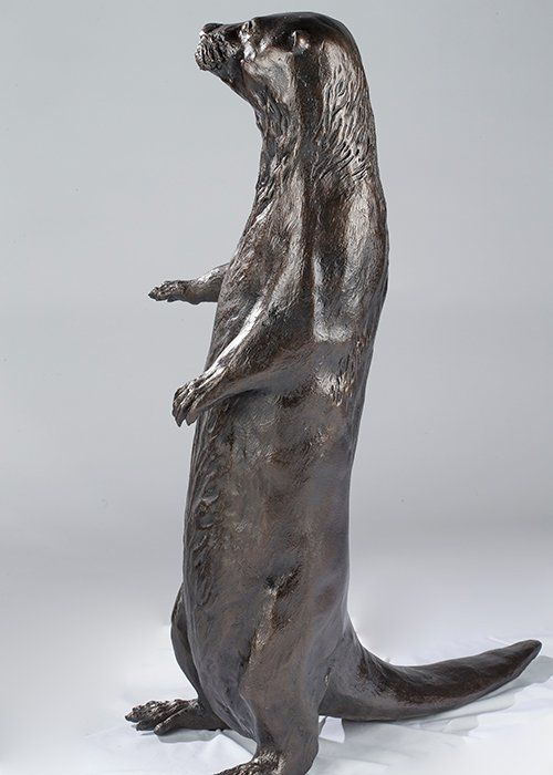 standing otter sculpture in bronze
