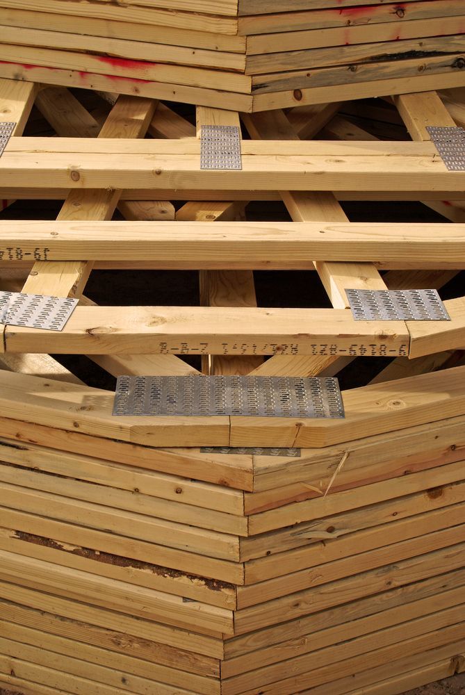 A Stack of Wooden Roof Trusses — Roof Trusses in Caloundra, QLD