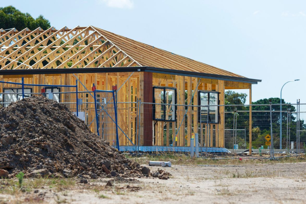 A House Under Construction With a Pile of Dirt — Roof Trusses in Landsborough, QLD