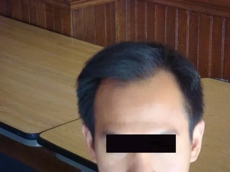 A woman is getting her eyebrows done at a beauty salon.