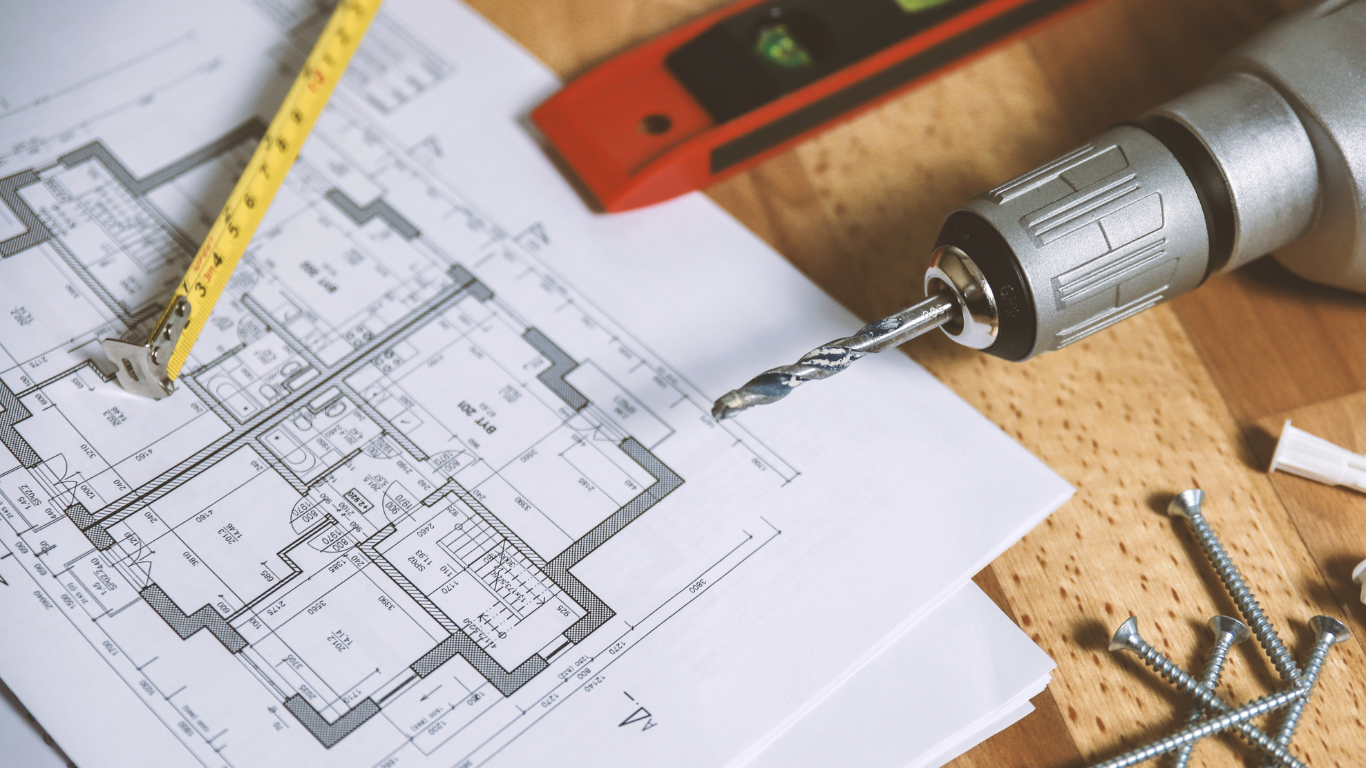 a white house with a blue door and a porch .