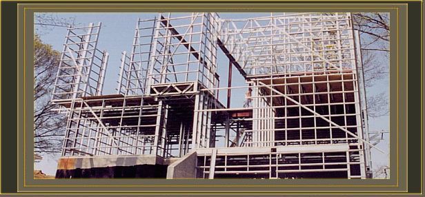 a picture of a building under construction with scaffolding around it