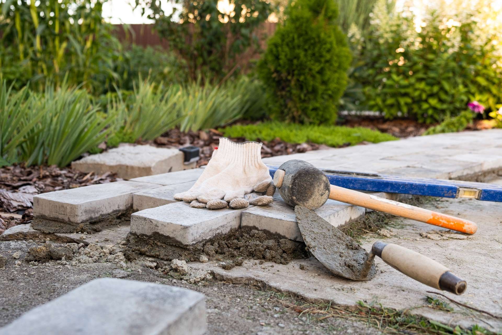 Paving stones being laid depicting landscape construction in Southern Adelaide