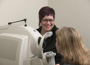A woman is undergoing an eye check-up.